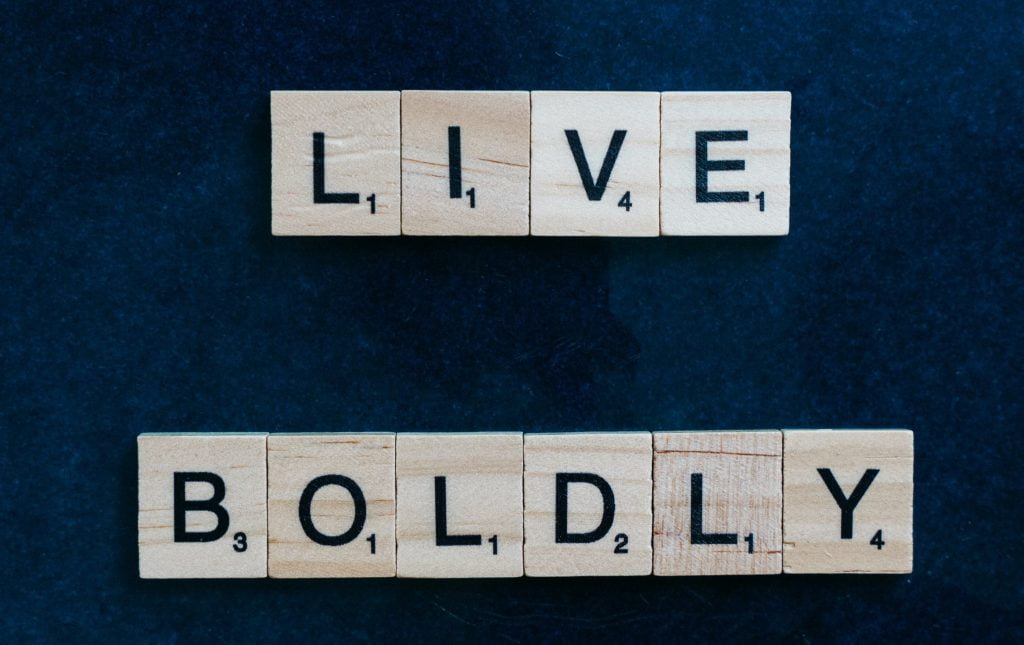 the text live boldly wirtten using scrabble tiles