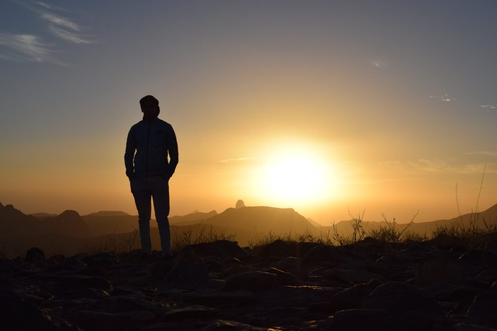 silhouette of a man in front of sunset