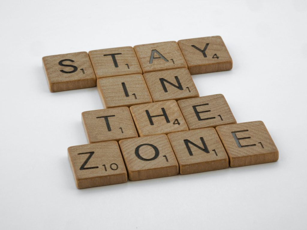 stay in zone written with scrabble tiles